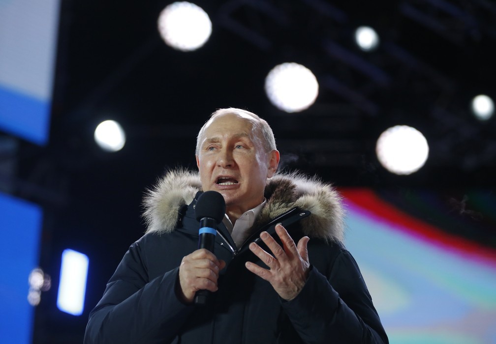 Vladimir Putin comemora reeleiÃ§Ã£o neste domingo (18) (Foto: Alexander Zemlianichenko/AP)